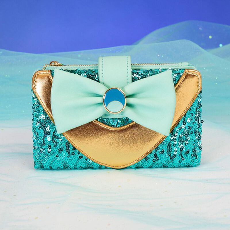 Teal sequin flap wallet in the same style as Jasmine's outfit from Disney's Aladdin, featuring gold detail and a light blue bow.